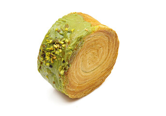 Cromboloni New York roll puffed pastry dessert filled with pistachio cream isolated on white background