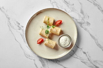 Savory chicken crepe rolls with creamy dipping sauce
