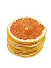 Stack of red dry grapefruit slices isolated on white background