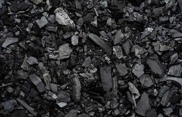 Black charcoal texture close-up, top view, background
