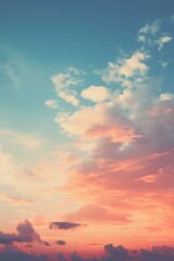 Obraz premium A vibrant sunset sky with clouds in various colors creating a vintage style background