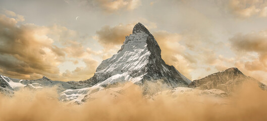 panoramic view to the majestic Matterhorn mountain in the evening sky