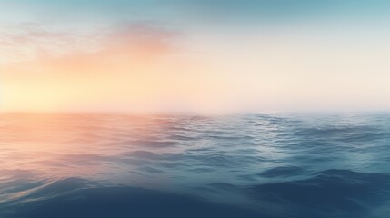 Obraz premium A misty sunrise over the ocean with fog obscuring the view. 