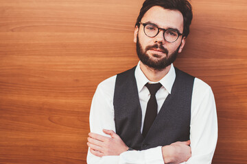 Caucasian hipster guy in formal apparel posing near copy space area for advertising text outdoors,...