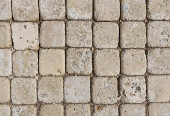  The image provides a detailed view of the stone paving, highlighting the craftsmanship involved in its installation and the natural beauty of the materials used...