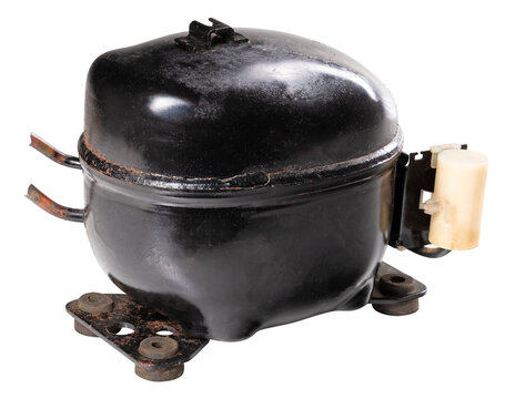 Old generator, refrigerator compressor. Isolated background.