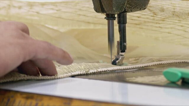 Tailor Sews Net Curtains with Sewing Machine Footage.