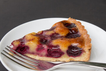Pie shortcrust pastry with cherry filling. Closeup