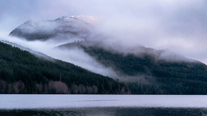 mountain in fog at sunset
