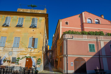 Ancient street between two colorful houses