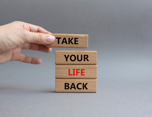 Take your life Back word symbol. Wooden blocks with words Take your life Back word. Psychologist hand. Beautiful grey background. Psychology and Take your life Back word. Copy space.