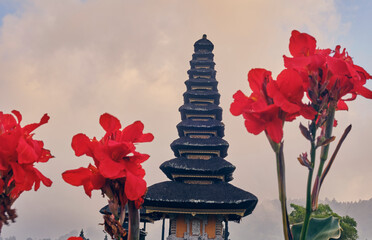 pura ulun danu bratan temple in Bali with red flowers