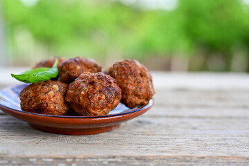 Home made Fried  pork meatballs  outdoor on wooden rustic background