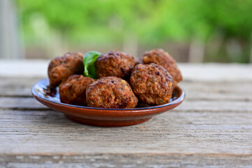 Home made Fried  pork meatballs  outdoor on wooden rustic background