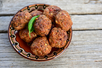Home made Fried  pork meatballs  outdoor on wooden rustic background