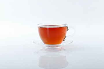 Tasty tea in cup on white background