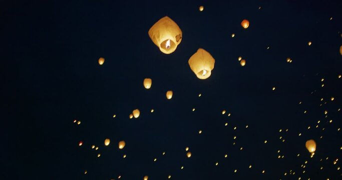 Low shot of beautiful Chinese lanterns in night sky