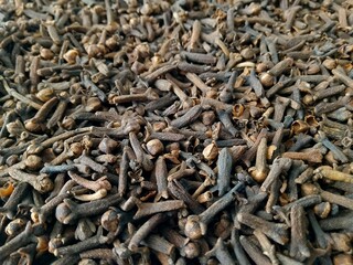 Cloves for Health: A Natural Remedy for Everyday Ailments, close up shot of various used bullet casings scattered on the ground, detailed metallic textures, gritty, realistic