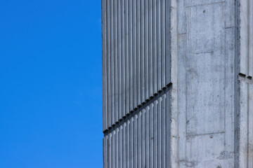 concrete column of a bridge support against a blue sky