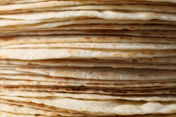 Stack of tasty tortillas as background, closeup