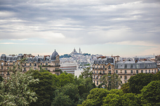 View of Montmartre from the Parc des Buttes Chaumont in Paris, France on an Overcast Day