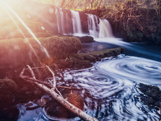 Stunning nature scene at Fowley's fall. Waterfall with blurred water. Nature background. Travel and...