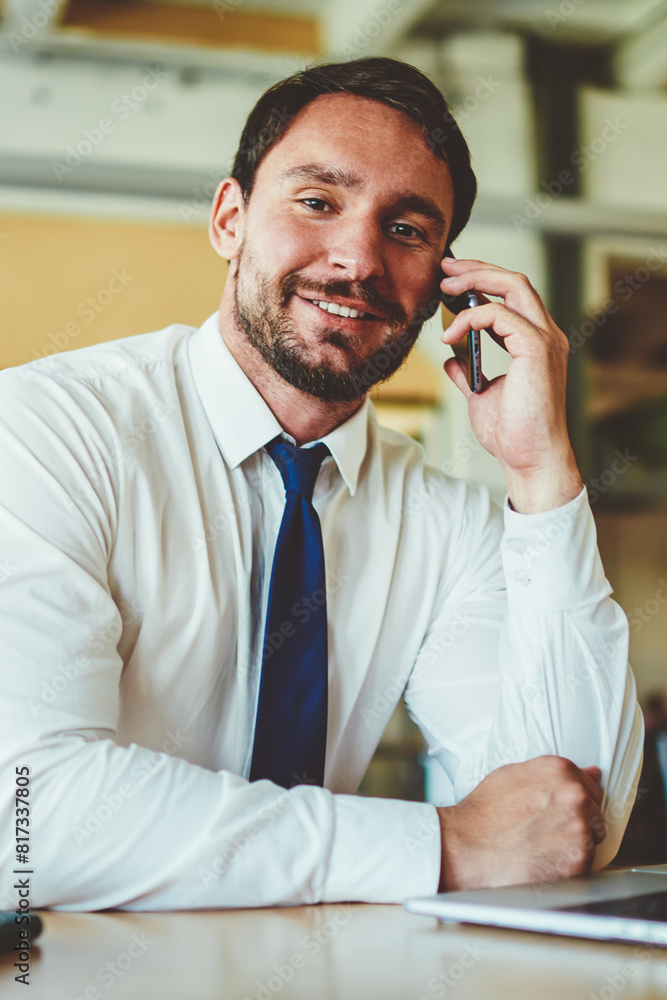 Aufkleber portrait of successful businessman looking at camera and enjoying friendly telephone conversation du