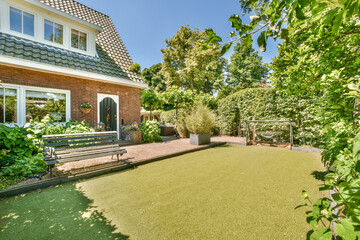 Idyllic backyard with artificial turf at Molenveenweg