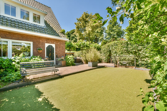 Idyllic backyard with artificial turf at Molenveenweg