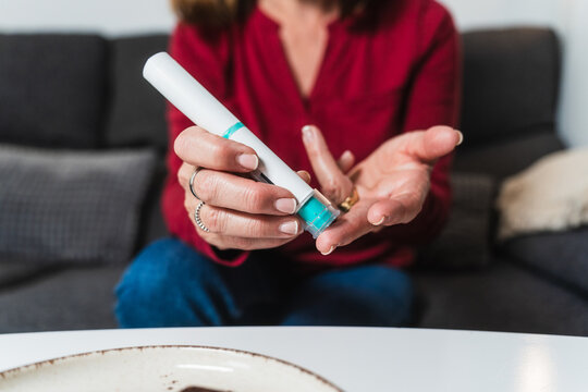 Woman preparing insulin injection for hypoglycemia management