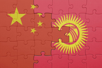 puzzle with the colourful national flag of kyrgyzstan and flag of china .