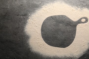 Imprint of board on grey textured table with flour, top view. Space for text