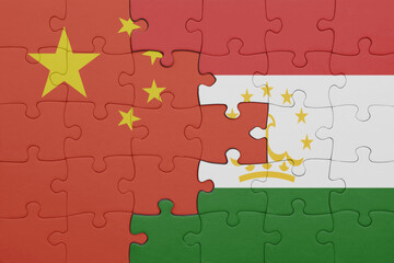 puzzle with the colourful national flag of tajikistan and flag of china .