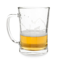 Half empty mug of beer isolated on white