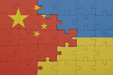 puzzle with the colourful national flag of ukraine and flag of china .