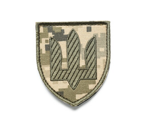 Military badge of Ukrainian army with trident isolated on white background