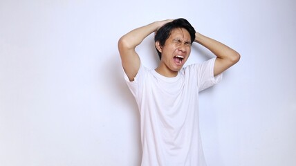 young asian man in white shirt with expression dizzy, stressed, depressed, mentally damaged, lost,...