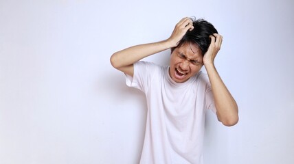 young asian man in white shirt with expression dizzy, stressed, depressed, mentally damaged, lost,...