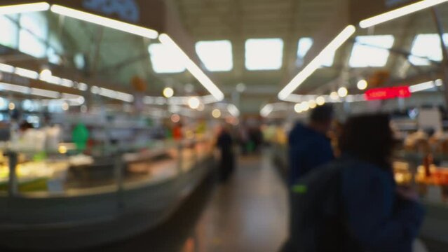 Blurry background footage of people in a central market