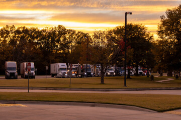  Truck stop comes alive under a stunning twilight sky, a temporary home for travelers and freight...