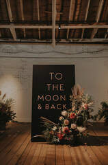 Photoshoot scene with a sign "To the moon & back".Minimal creative party,art and advertise concept