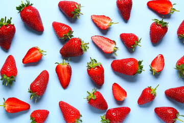 Sweet fresh strawberries on blue background
