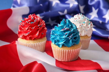 Tasty patriotic cupcakes with USA flag, closeup. American Independence Day