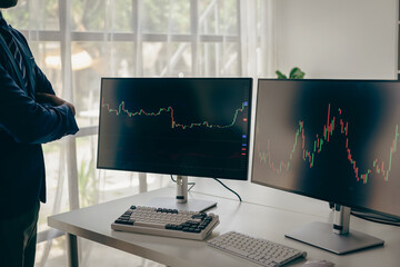 Businessman confidently analyzes stock market graph It emphasizes possible investment opportunities. Financial analyst analyzes stock market trading graphs economic growth chart