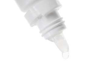 Dripping medical drops from bottle on white background