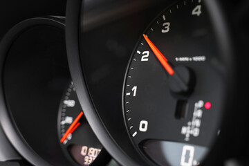 Speedometer and tachometer inside of modern car, closeup