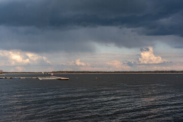 Overcast sky over a lake in the mountains. Clouds and the lake. 