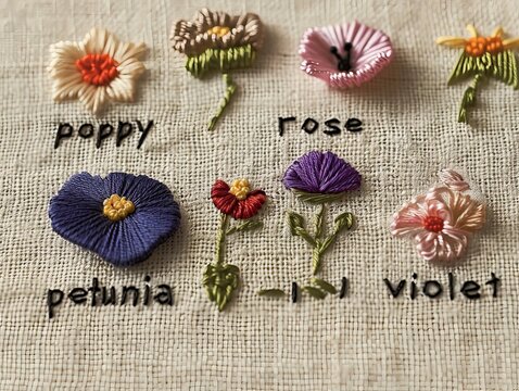 colorful flowers embroidered with their names ona linen cloth