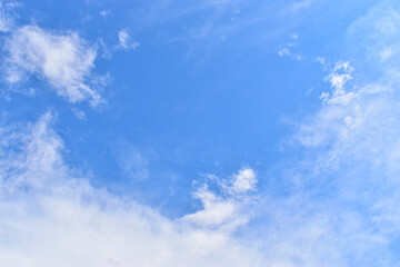 Obraz premium beautiful blue sky and white fluffy group of clouds with sunrise in the morning, natural background