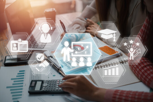 Trainee concept, Business team analyzing income charts and graphs on desk with intern, support, cooperation, improve, mentor and education icon on virtual screen.